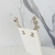 Brinco Ear Cuff festa folhas cristais cinza metalizado banhado a prata na internet