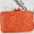 Bolsa clutch laranja tecido texturizado - comprar online