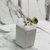 Anel de pedra gota verde esmeralda cravejado com zircônias banhado a ouro na internet