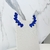 Brinco ear cuff festa folha com pedras e cristais azuis banhado a ródio negro na internet