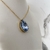 Imagem do Conjunto colar e brinco pedra gota G azul grisaceo, base dourada