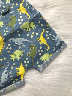 Jardineira Ilhós Dinossauros Jeans na internet