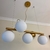 Lustre Pendente Moderno Dourado Fosco 5 Globos Branco na internet