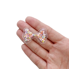Aplique Mini Lacinho Plástico com Estrelas Coloridas - 2 unidades - comprar online