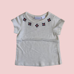 Remera manga corta de algodón beige con flores Firts Impressions *NUEVO* - 6-9M