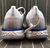 Nike Epic React Flyknit White Gold Blue Silver na internet