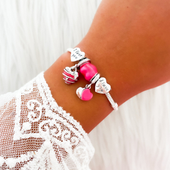 PULSERA CON CHARMS ¨I LOVE YOU¨ - DIJES FUCSIA